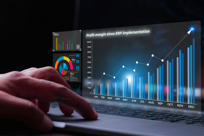 Data analyst working on business analytics dashboard with charts, with KPI and metrics connected to the database for technology finance, operations, sales, marketing